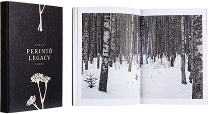 A cover and a spread of the book Perintö - Legacy.