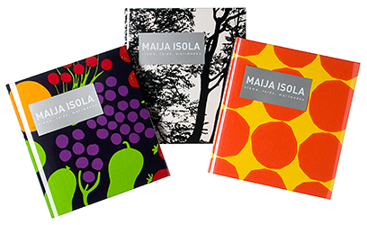 Kansi ja aukeama kirjasta Maija Isola – elämä, taide, marimekko.