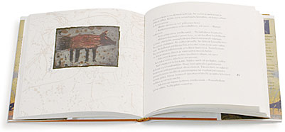 A cover and a spread of the book Gepardi katsoo peiliin.