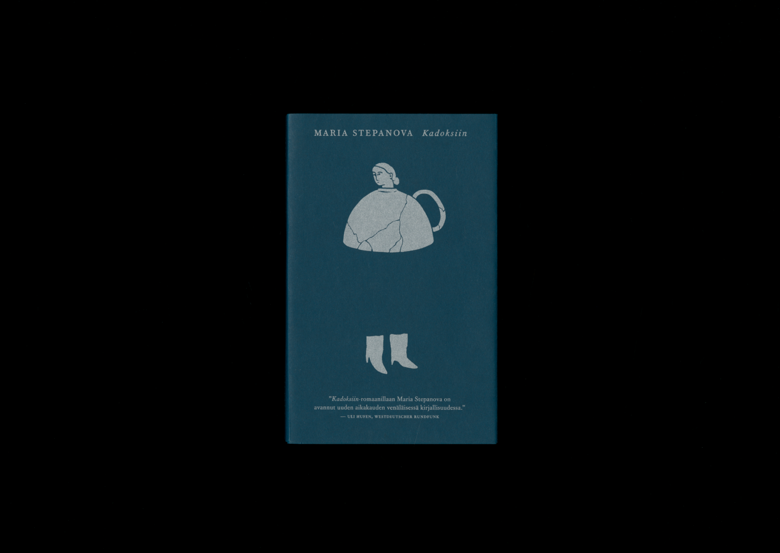 Kansi ja aukeama kirjasta Kadoksiin.